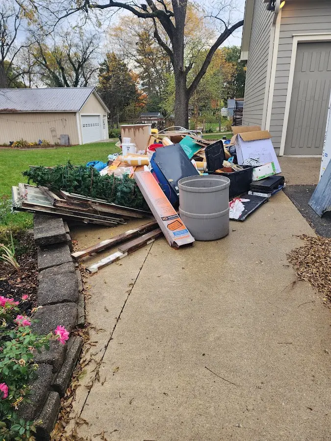 Dumpster being loaded with debris for Commercial Dumpster Rental in Colville